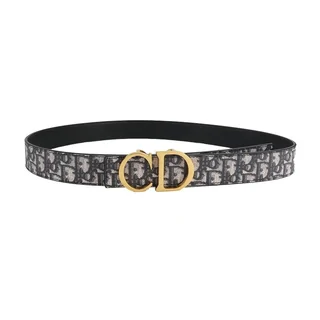 A single black monogram-patterned belt coiled on a plain background, with a gold lettered buckle
