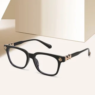 A pair of black square optical frames shown at an angle, with a metal motif on the temple