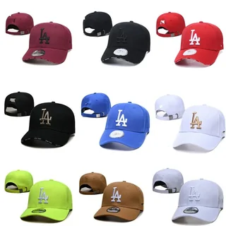Nine baseball caps in white, black, green, red and orange, arranged in a grid with their underbrims shown